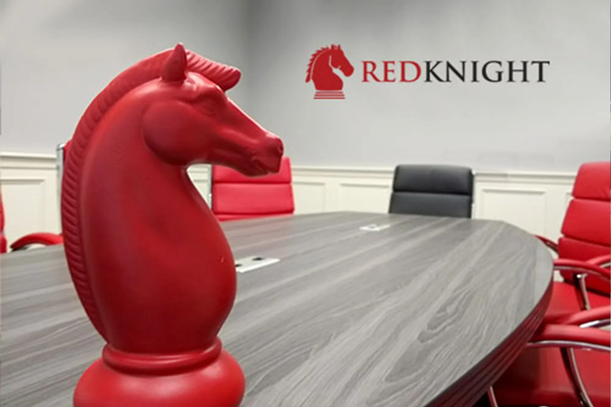 Real-life RedKnight horse on top of a meetings table
